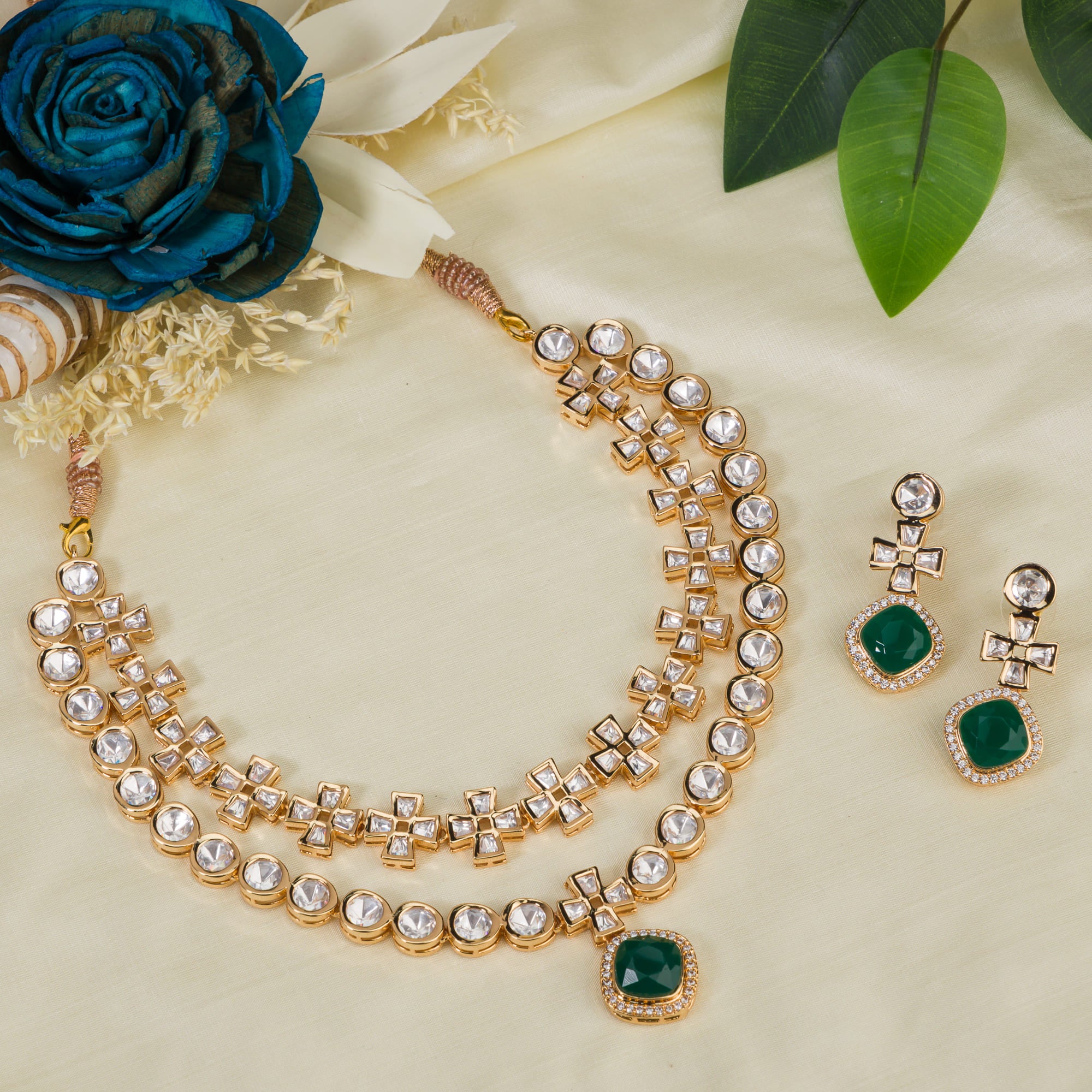 Double-layer zircon necklace set with green pendant and matching earrings for a striking party look.
