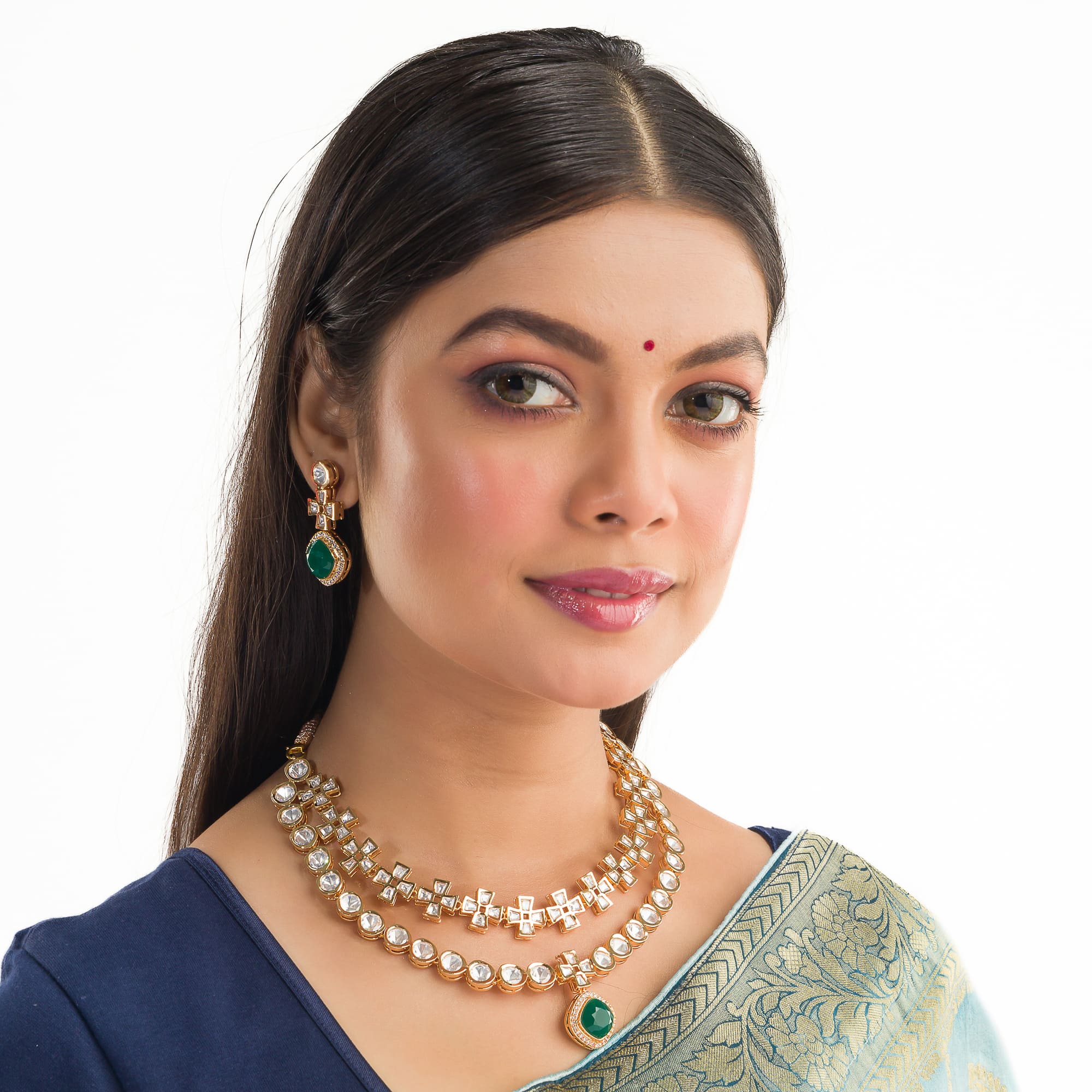 Double-layer zircon necklace set with green pendant and matching earrings for a striking party look.
