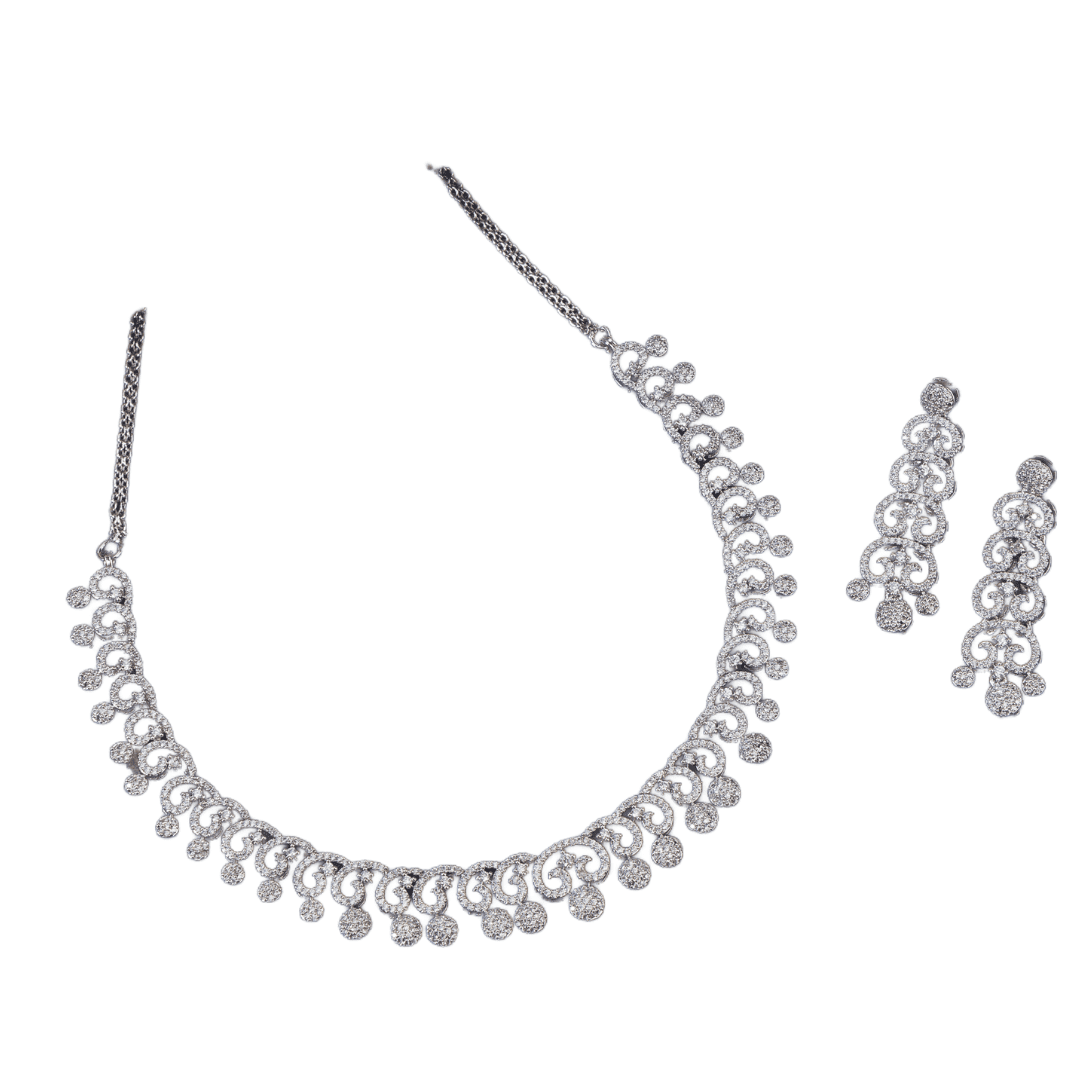 THIS WHITE ZIRCON STONE-STUDDED SHORT NECKLACE SET EXUDES TIMELESS ELEGANCE AND SOPHISTICATION. INCLUDES MATCHING EARRINGS,