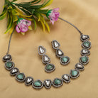 Turquoise and white zircon necklace set with sleek black polish for a bold and stylish design.
