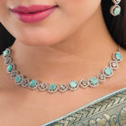 Turquoise and white zircon necklace set for a vibrant and elegant party look.
