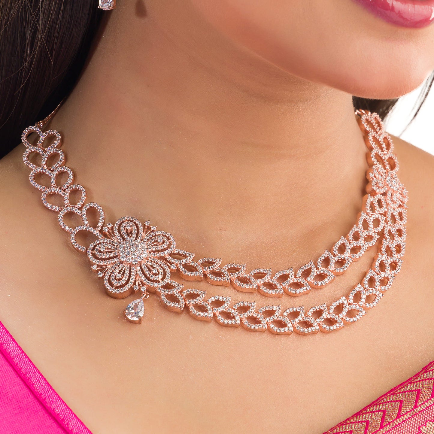 THIS ROSE GOLD POLISHED NECKLACE SET, FEATURING ZIRCON-STUDDED FLOWER DESIGNS, WITH BEAUTIFUL MATCHING EARRINGS,