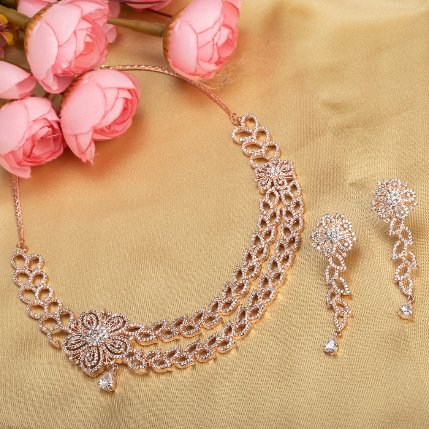 THIS ROSE GOLD POLISHED NECKLACE SET, FEATURING ZIRCON-STUDDED FLOWER DESIGNS, WITH BEAUTIFUL MATCHING EARRINGS,