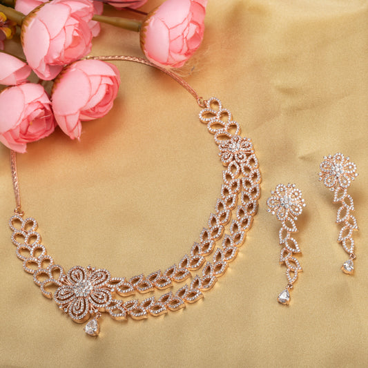 THIS ROSE GOLD POLISHED NECKLACE SET, FEATURING ZIRCON-STUDDED FLOWER DESIGNS, WITH BEAUTIFUL MATCHING EARRINGS,