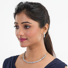 Zircon-studded silver necklace set with a dazzling and refined design for parties.
