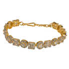 Golden zircon-studded bracelet with shimmering stones, perfect for an elegant party look.
