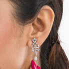 Sparkling silver zircon pendant set with earrings, adding a touch of luxury to any outfit.
