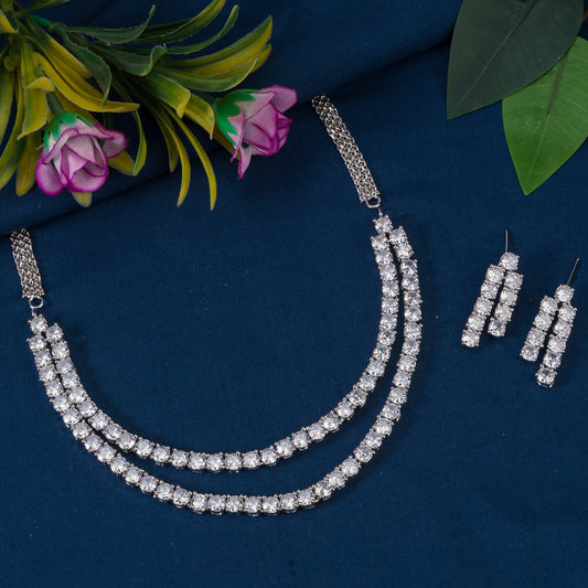 THIS DOUBLE-LAYER NECKLACE SET FEATURES  WITH WHITE ZIRCON STONES, COMPLEMENTED BY MATCHING EARRINGS