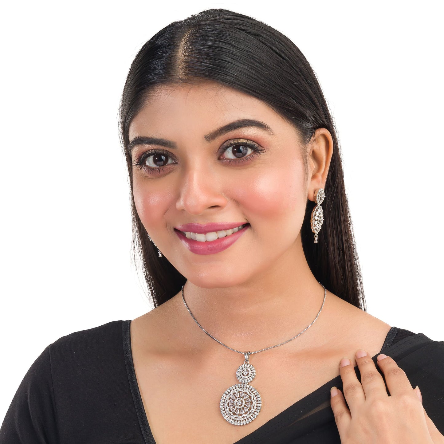 THIS PENDANT SET FEATURES FLORAL DESIGN ADORNED WITH WHITE ZIRCON STONES , PAIRED WITH MATCHING EARRINGS, .