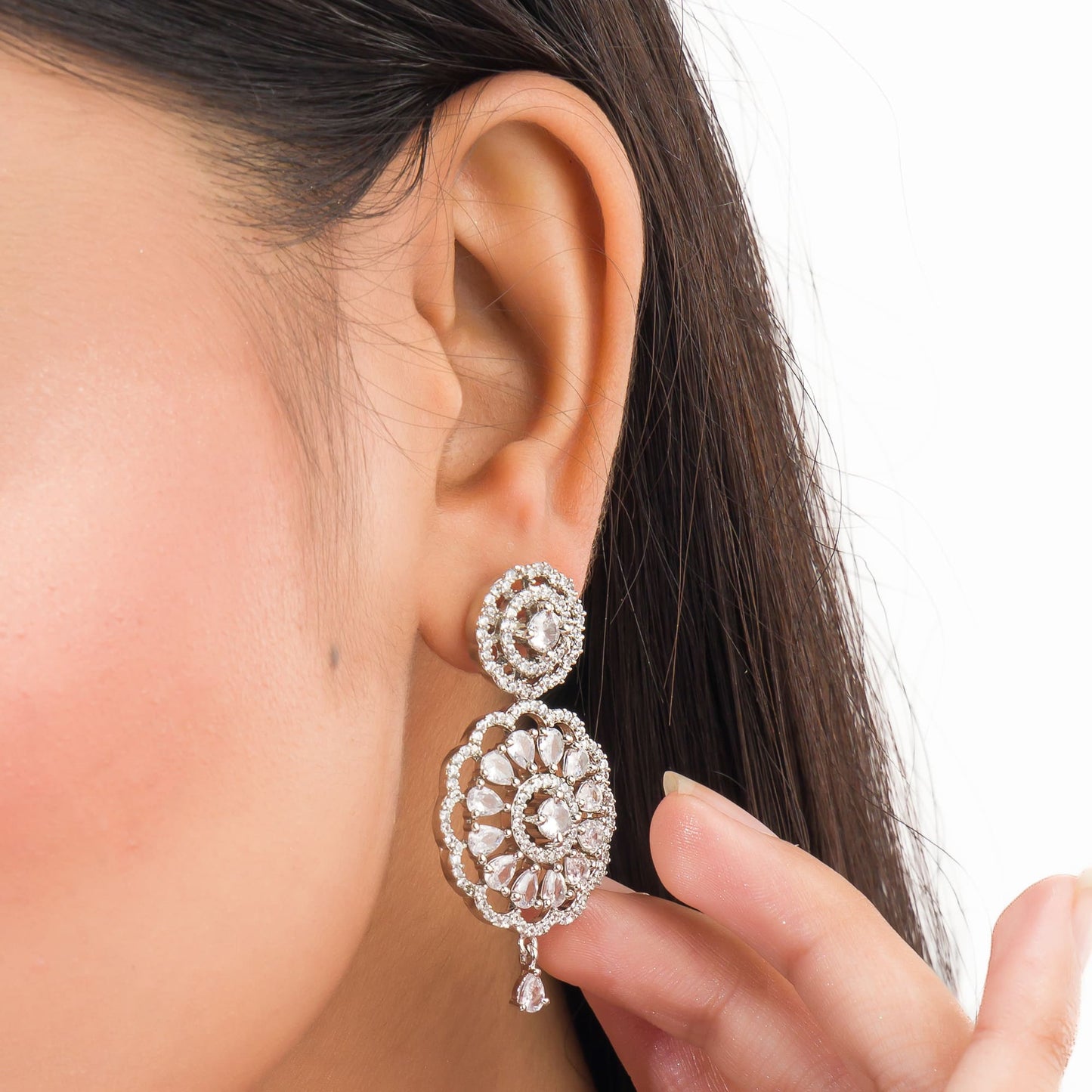 THIS PENDANT SET FEATURES FLORAL DESIGN ADORNED WITH WHITE ZIRCON STONES , PAIRED WITH MATCHING EARRINGS, .