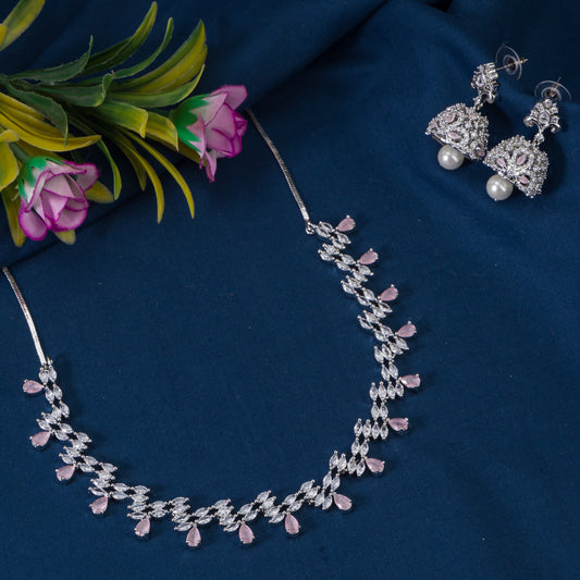 THIS EXQUISITE ORCHID-COLORED STONE-STUDDED ZIRCON NECKLACE SET WITH MATCHING ZIRCON JHUMKA