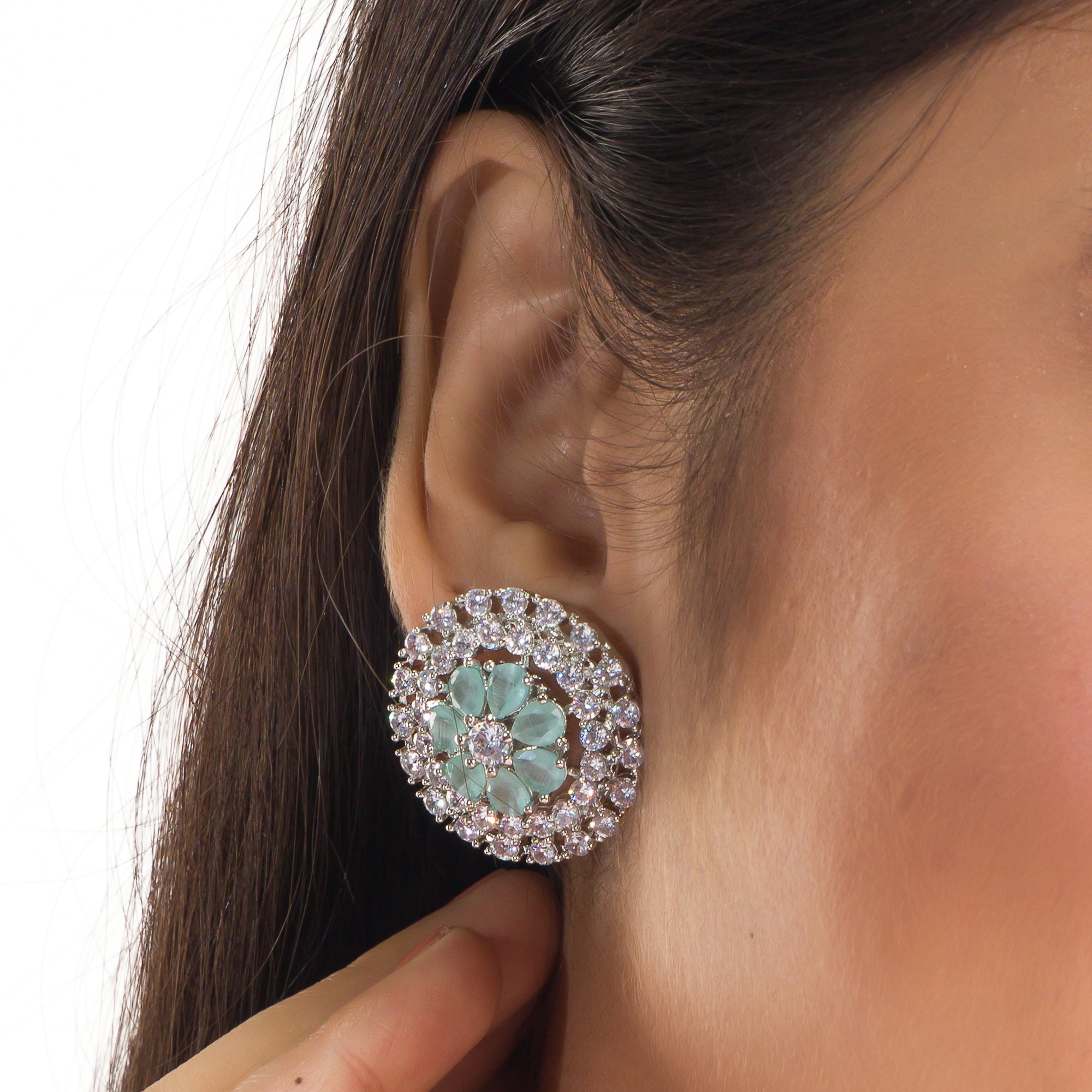 Floral zircon pendant set with turquoise and white stones, paired with matching earrings.
