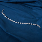 Silver zircon-studded chain bracelet, perfect for adding shimmer to your party wear.
