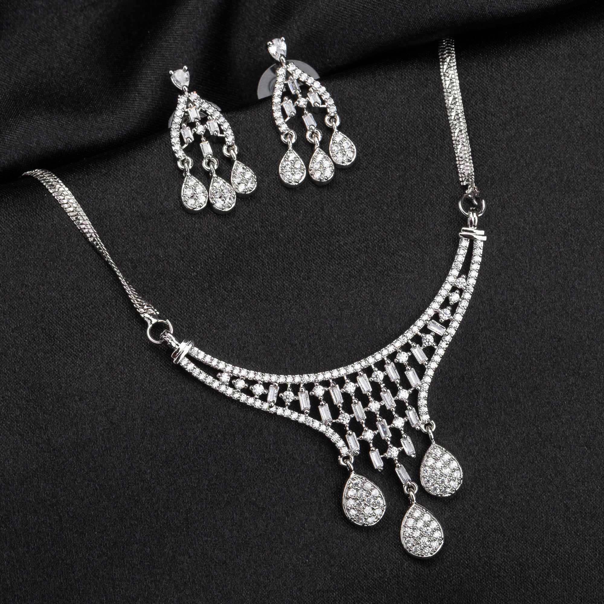 White zircon pendant and earrings set, perfect for festive elegance and timeless style.
