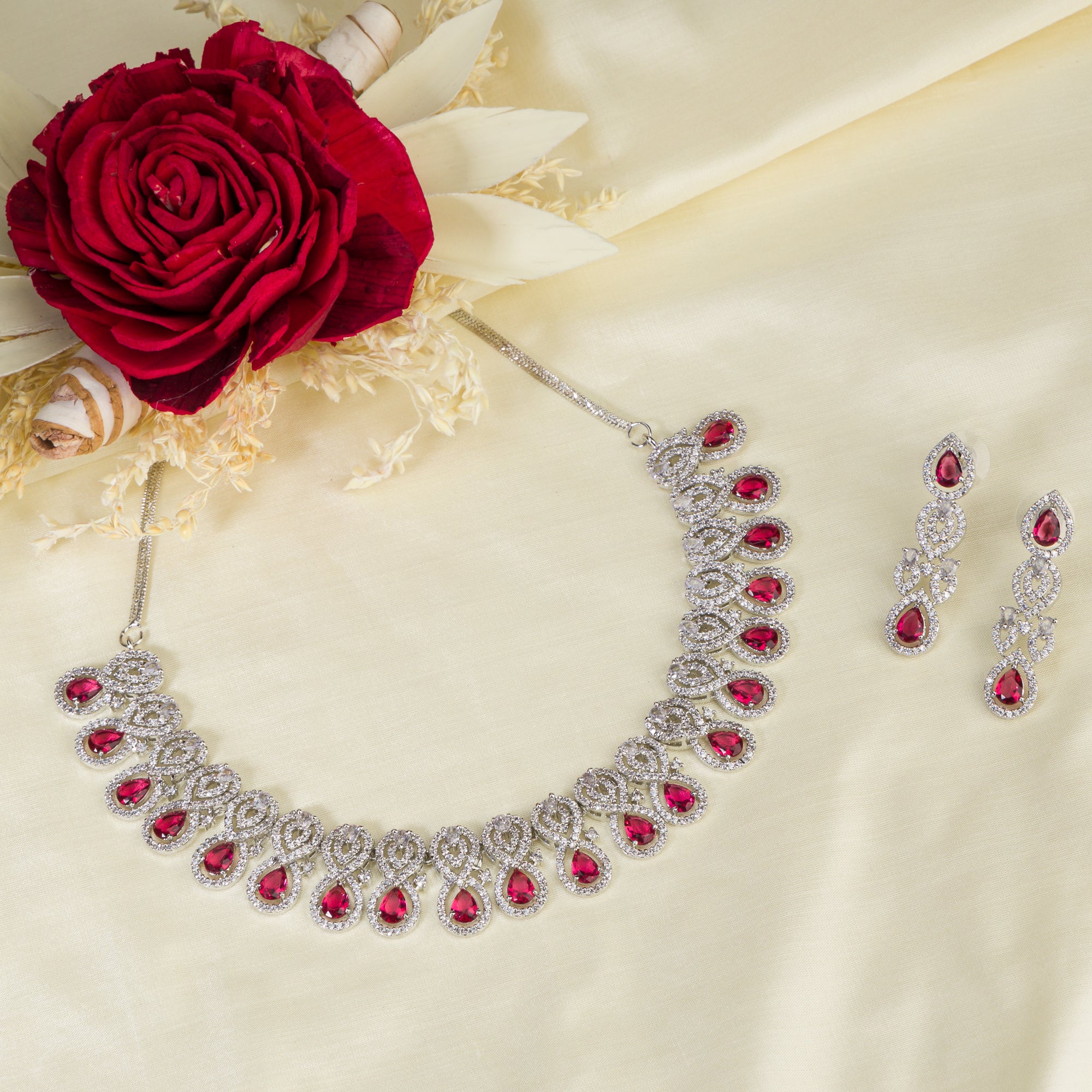 Bold red zircon necklace set, combining vibrant red stones with dazzling zircon sparkle for elegance.
