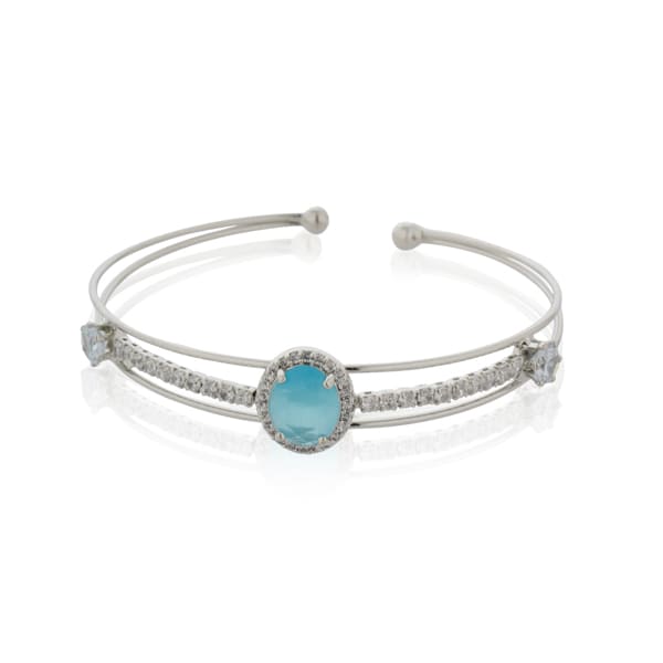 MAKE A SPLASH WITH THIS STUNNING AQUA-COLORED STONE-STUDDED ZIRCON BRACELET. THE VIBRANT AQUA STONES, PAIRED WITH SPARKLING ZIRCON ACCENTS.