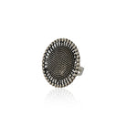 Oxidized silver finger ring with intricate patterns and antique finish for vintage charm.
