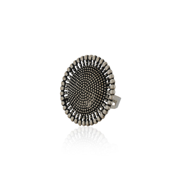 Oxidized silver finger ring with intricate patterns and antique finish for vintage charm.
