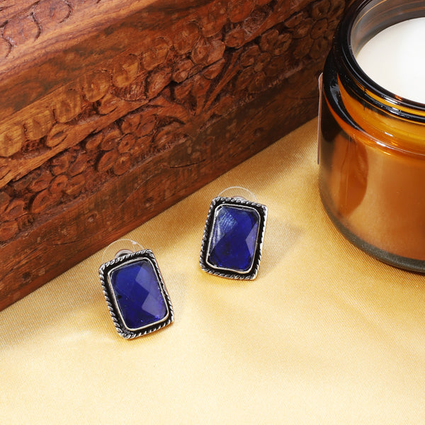 Vintage oxidized earrings with blue stones, adding vibrant color and charm.
