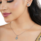 "925 silver pendant and earrings set with floral design, exuding elegance and sophistication."
