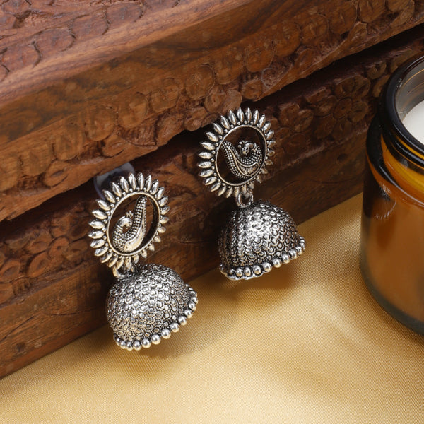 "Timeless oxidized silver jhumkas with detailed craftsmanship, perfect for festive occasions."
