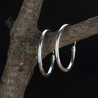 "Classic 925 sterling silver hoops for everyday elegance and versatile festive wear."
