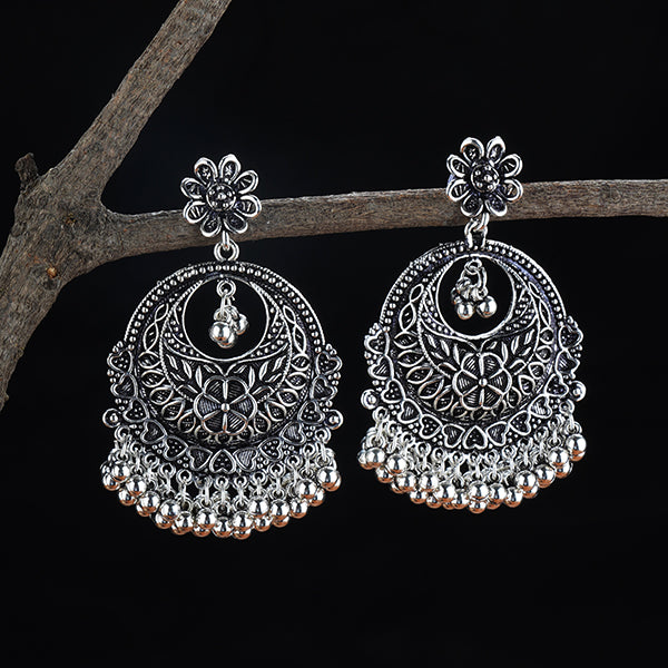 "Exquisitely crafted oxidized danglers with vintage charm, perfect for festive elegance."
