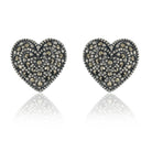 "925 silver heart-shaped studs, blending timeless elegance with everyday style."
