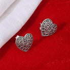 "925 silver heart-shaped studs, blending timeless elegance with everyday style."
