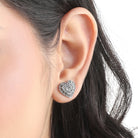 "925 silver heart-shaped studs, blending timeless elegance with everyday style."
