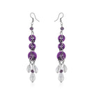 "Purple button-studded oxidized danglers, adding a chic and stylish touch to festive outfits."
