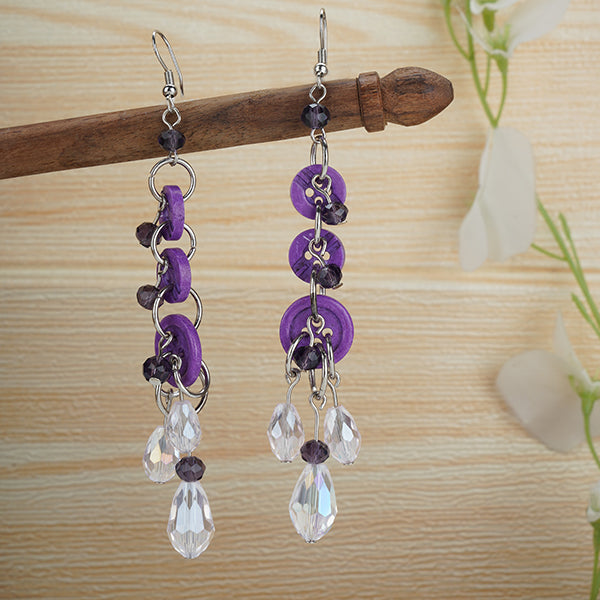 "Purple button-studded oxidized danglers, adding a chic and stylish touch to festive outfits."
