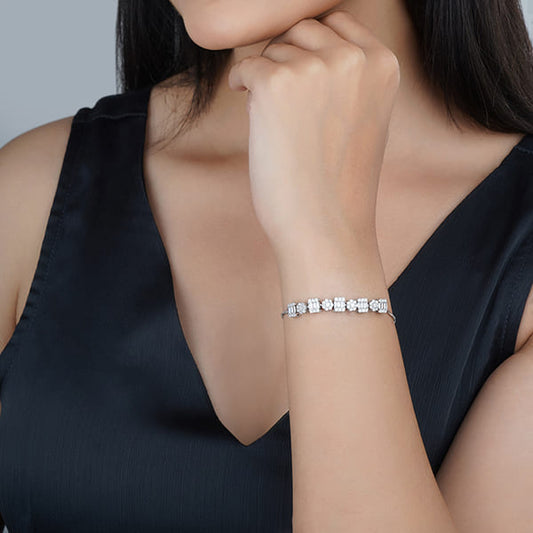 ELEGANT 925 SILVER ADJUSTABLE BRACELET, ADORNED WITH SPARKLING ZIRCON STONES. THIS VERSATILE PIECE COMBINES TIMELESS BEAUTY