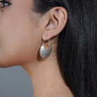 Classic 925 sterling silver hoops, offering timeless elegance and style for party occasions.
