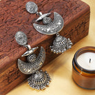 Traditional oxidized long jhumka earrings with intricate detailing for festive elegance.
