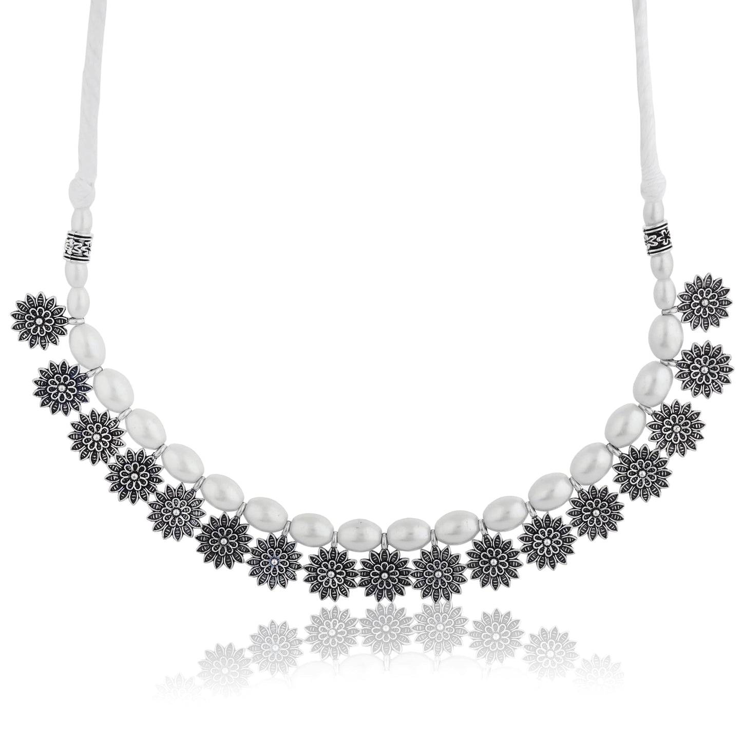 STYLISH OXIDIZED CHOKER WITH INTRICATE FLORAL DESIGN, ADORNED WITH WHITE PEARLS. THIS ELEGANT PIECE COMBINES VINTAGE CHARM