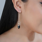 Elegant 925 silver dangler earrings with sparkling star studs for a chic and glamorous party look.
