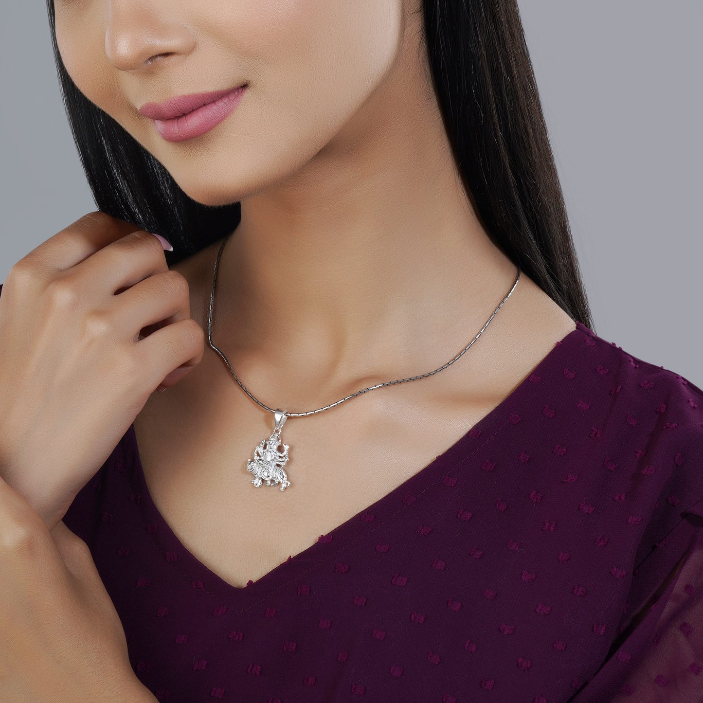 INTRICATELY CRAFTED 925 SILVER PENDANT FEATURING A DETAILED GODDESS DURGA DESIGN. THIS ELEGANT PIECE SYMBOLIZES STRENGTH AND DEVOTION