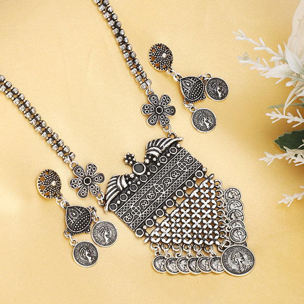 Long oxidized necklace set with intricate designs, blending traditional artistry with vintage charm.
