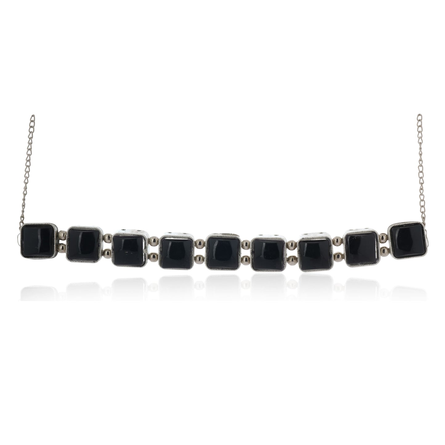 ELEGANT NECKLACE SET STUDDED WITH BLACK STONES, PAIRED WITH MATCHING EARRINGS.