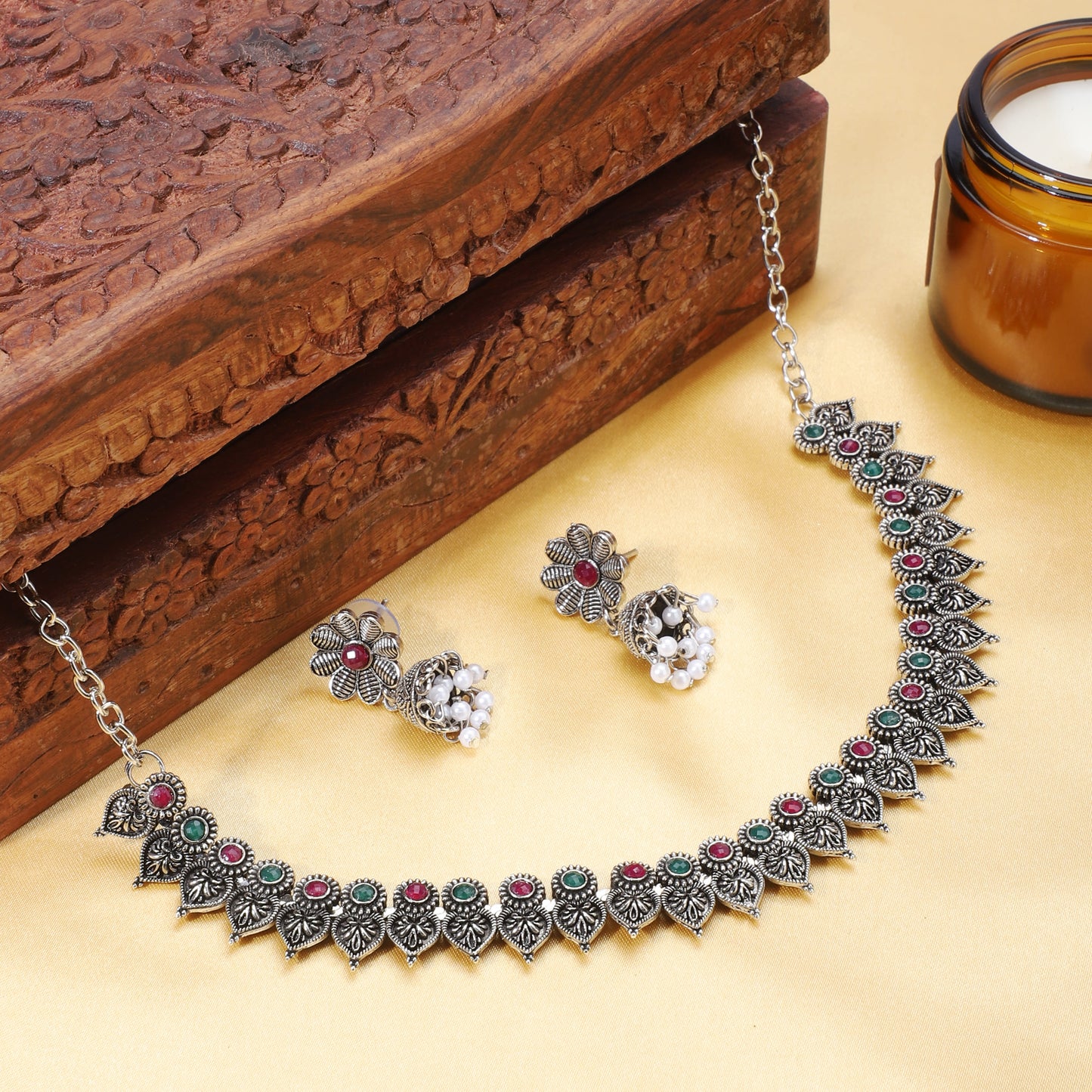 ELEGANT OXIDIZED NECKLACE SET FEATURING GREEN AND PINK STONES. THE SET INCLUDES A MATCHING PAIR OF JHUMKA EARRINGS