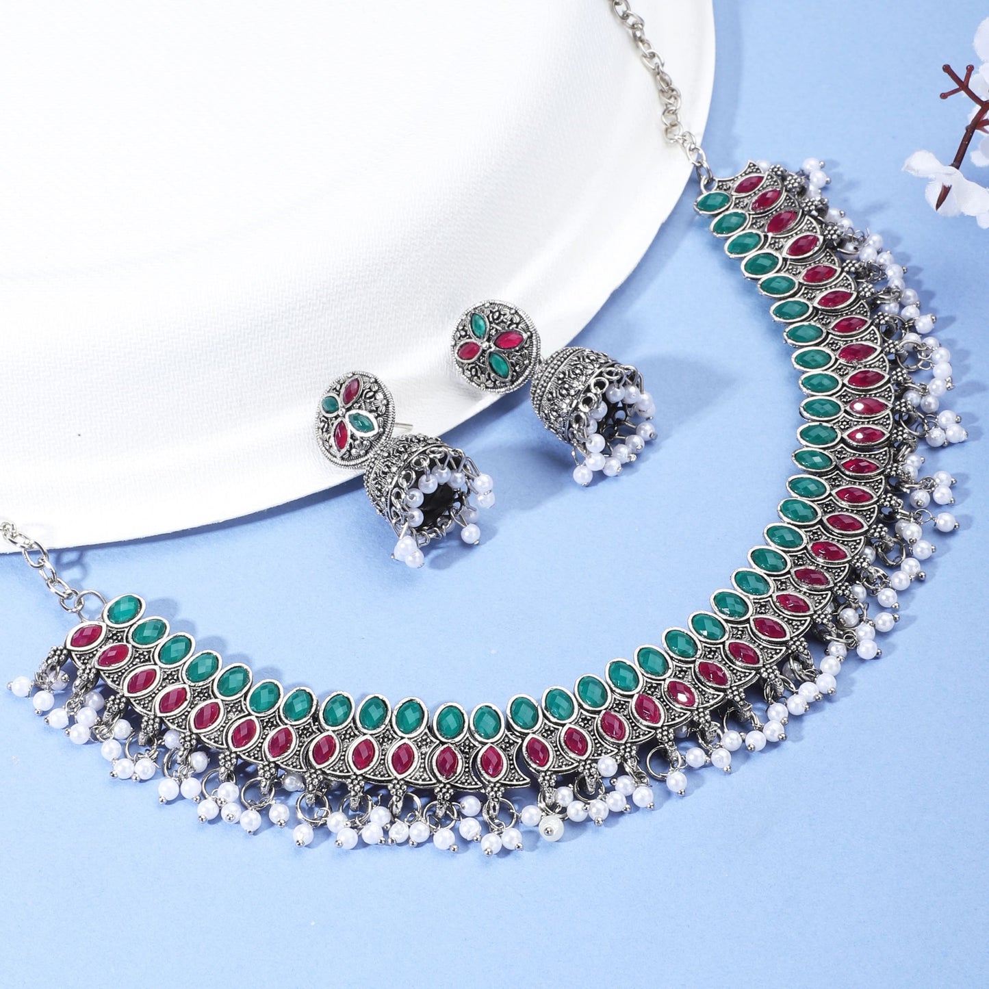 ELEGANT OXIDIZED NECKLACE SET FEATURING GREEN AND PINK STONES. THE SET INCLUDES A MATCHING PAIR OF JHUMKA EARRINGS