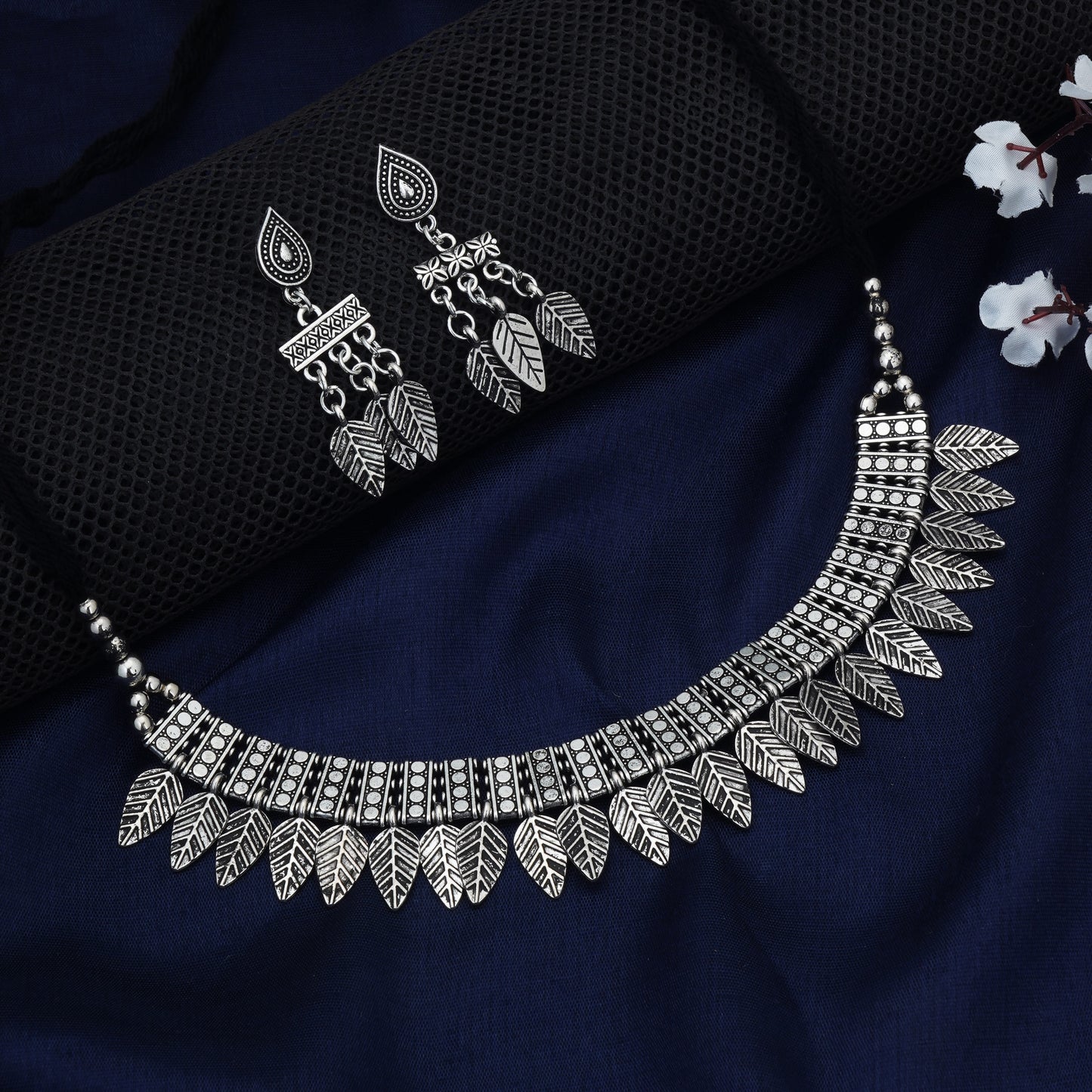 STYLISH OXIDIZED SHORT NECKLACE SET FEATURING INTRICATE LEAF DESIGNS.