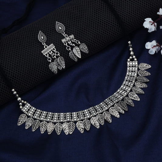 STYLISH OXIDIZED SHORT NECKLACE SET FEATURING INTRICATE LEAF DESIGNS.