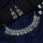 Stylish oxidized short necklace set with intricate leaf designs, perfect for festive elegance.
