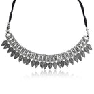 Stylish oxidized short necklace set with intricate leaf designs, perfect for festive elegance.
