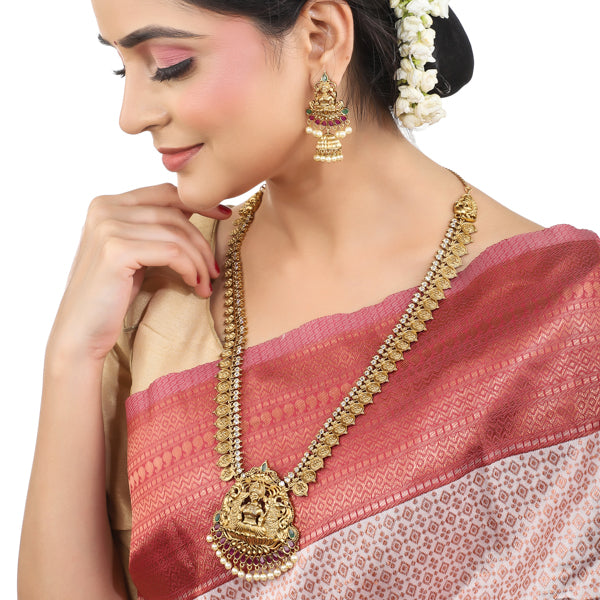 Exquisite Goddess Laxmi temple necklace set with matching earrings, perfect for festive wear.
