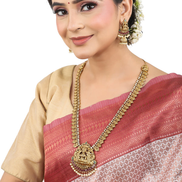 Exquisite Goddess Laxmi temple necklace set with matching earrings, perfect for festive wear.
