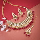 Elegant Kundan bridal choker set with intricate pearls, perfect for festive celebrations.
