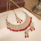 Elegant Kundan bridal choker set with intricate pearls, perfect for festive celebrations.
